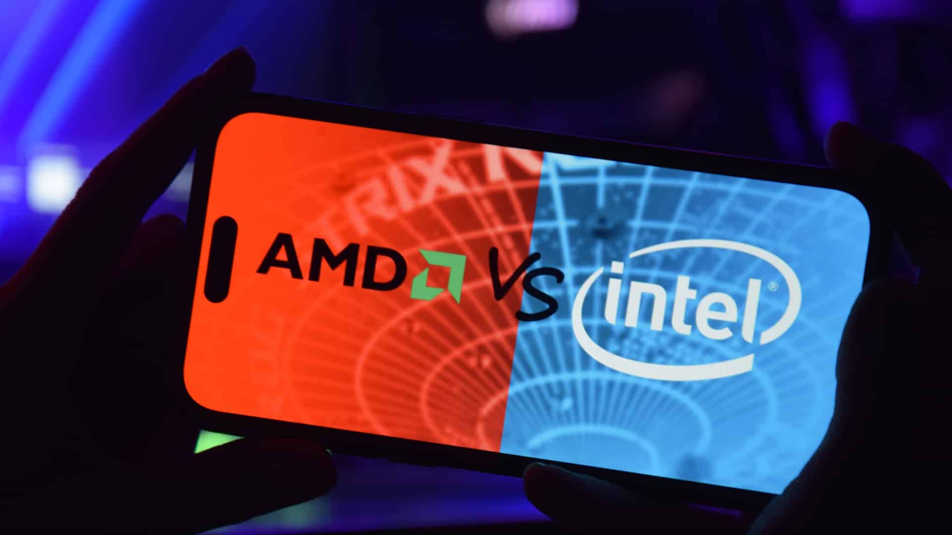 Telefon mit AMD und INTEL Logo auf Computerhintergrund